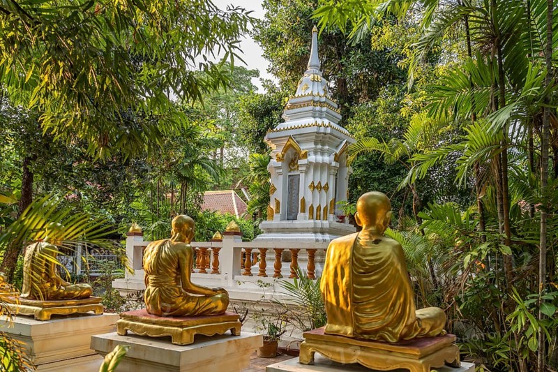 Golden statues of monks in the garden of the Buddhist temple complex Wat Phra Singh, Chiang Mai, Thailand, Asia