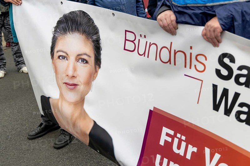 Portrait of Sahra Wagenknecht on a poster of the BSW (Sahra Wagenknecht Alliance) at the Die Waffen nieder demonstration on Breitscheidplatz in Berlin. The event is directed against all wars and calls for an immediate stop to all arms deliveries. Berlin, 03.10.2024
