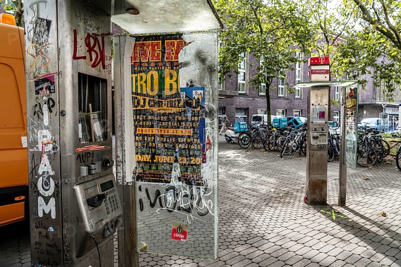 Old, no longer functional public telephones, of Telekom, destroyed, dirty, at the main railway station in Düsseldorf, North Rhine-Westphalia, Germany, Europe