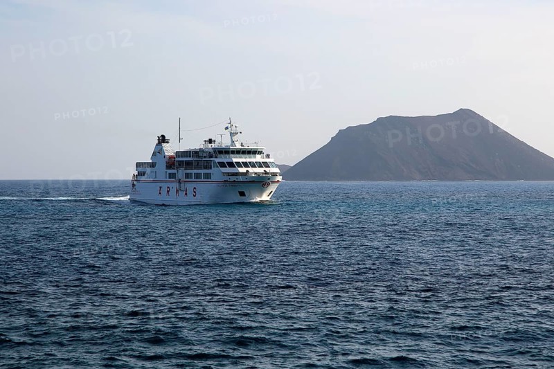 Armas ferry ship passing Los Lobos island, Corralejo, Fuerteventura, Canary Islands, Spain, Europe