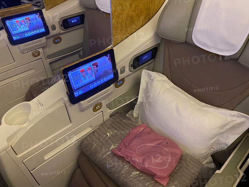 Interior view of Business Class seat with infotainment system, Boeing 777, Emirates airline, Frankfurt am Main Airport, Hesse, Germany, Europe