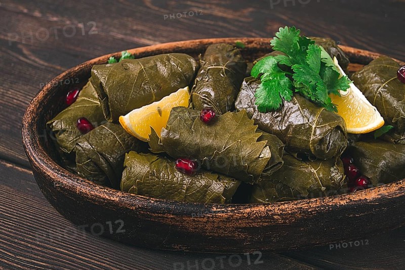 Dolma (Tolma) stuffed rolls, minced meat with rice, in grape leaves, top view, no people, close-up