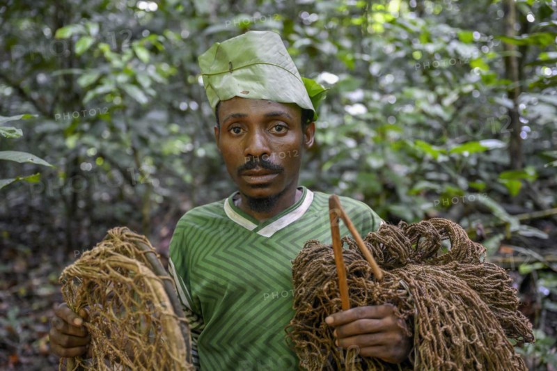 Pygmy of the Baka or BaAka people with his traps and hunting nets in the forest, Dzanga-Sangha Special Dense Forest Reserve, Sangha-Mbaéré Prefecture, Central African Republic, Africa