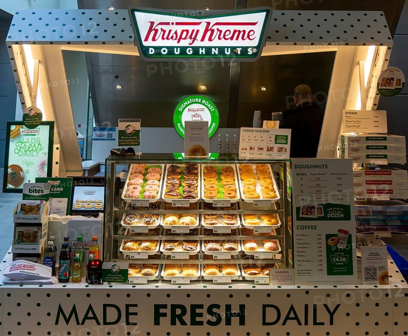 Krispy Kreme doughnuts stall in Buttermarket shopping centre, Ipswich, Suffolk, England, UK