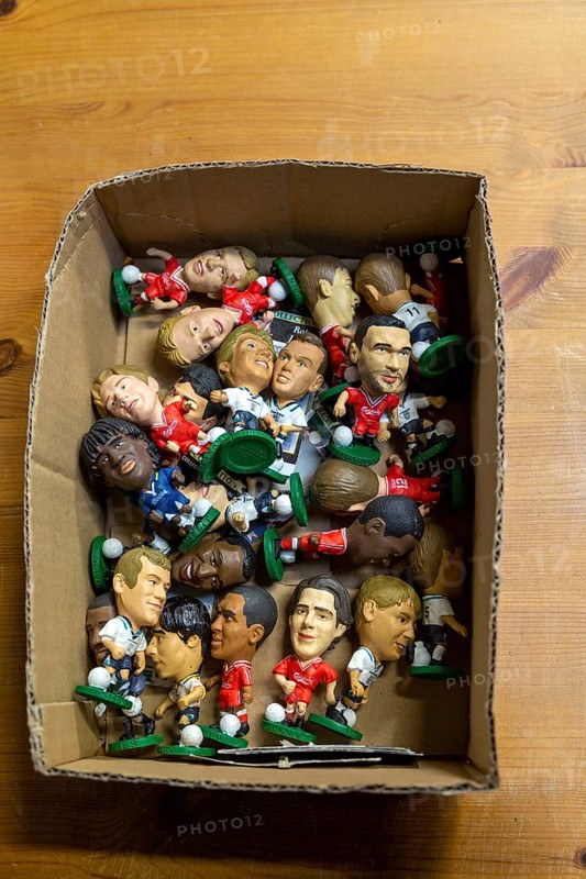 Plastic models of football players in cardboard box, UK