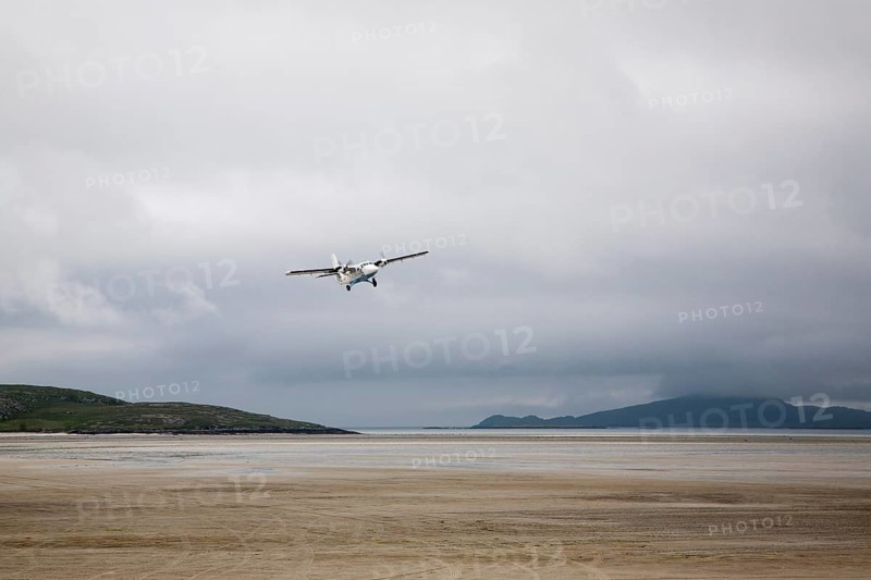 Flybe plane taking off from sandy airstrip Isle of Barra airport, Barra, Outer Hebrides, Scotland, UK