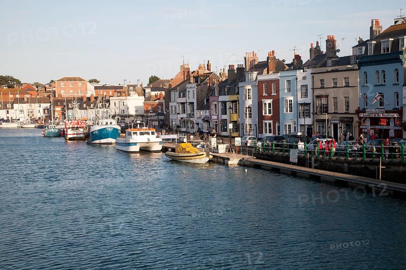 Colourful fishing boats in the harbour at Weymouth, Dorset, England, UK
