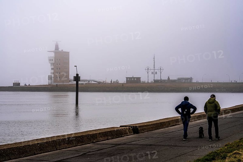 Thick fog in winter, hanging over the mouth of the Elbe into the North Sea, radar tower of the Cuxhaven Waterways and Shipping Authority (WSA), at the Alte Liebe viewpoint in Cuxhaven, Lower Saxony, Germany, Europe