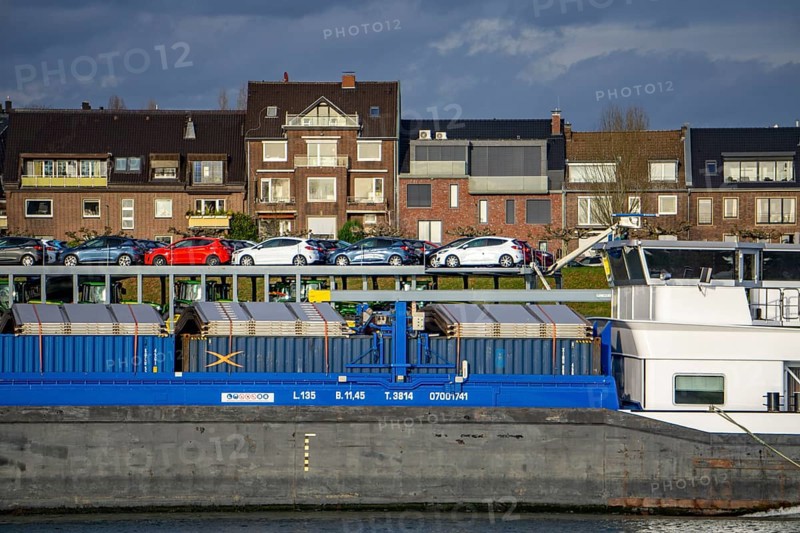 The Rhine near Düsseldorf, cargo ship, vehicle transporter Fuerte, of BLG Autotransport Logistics, houses in the Oberkassel district, North Rhine-Westphalia, Germany, Europe