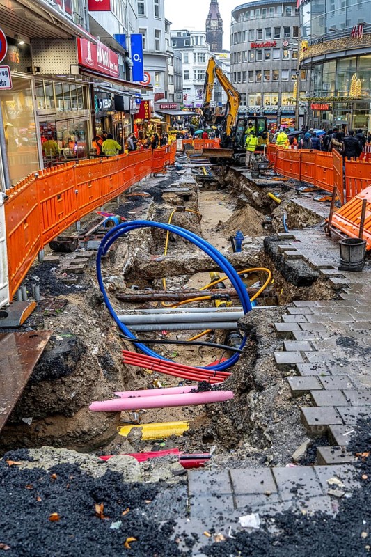 Construction site in the city centre of Wuppertal, laying of new pipelines, various supply lines exposed, Alte Freiheit street, North Rhine-Westphalia, Germany, Europe