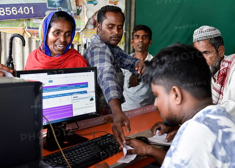 People checks their names in a roadside DTP centre, in the published final list of National Register of Citizens (NRC), in Morigaon district of Assam, India on 31 August 2019