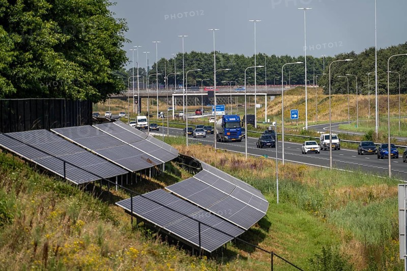 A58 motorway, photovoltaic systems were installed on the slopes to the side of the carriageway, use of the areas along the roads as a solar park, near Etten-Leur, Noord-Brabant, Netherlands