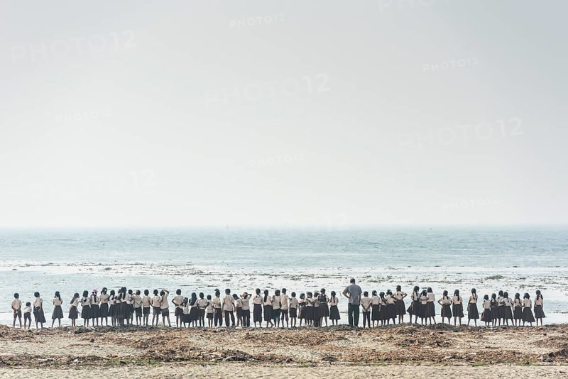 Large school class, children in school uniform and teacher on the beach, Fort Cochin, Kochi, Kerala, South India, India, Asia