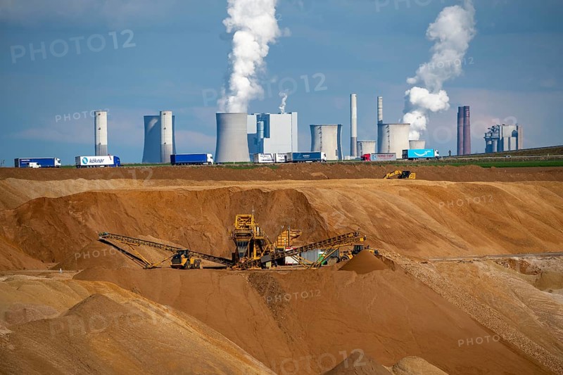 Garzweiler II open-cast lignite mine, excavator filling up the pit on the eastern edge of the open-cast mine, Neurath lignite-fired power station, A44 motorway, lorry, Jüchen, North Rhine-Westphalia, Germany, Europe
