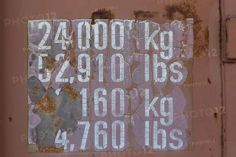 Close-up of maximum cargo cubic weight holding capacity indicated in kilograms and pounds on outside of shipping container, Quebec, Canada, North America