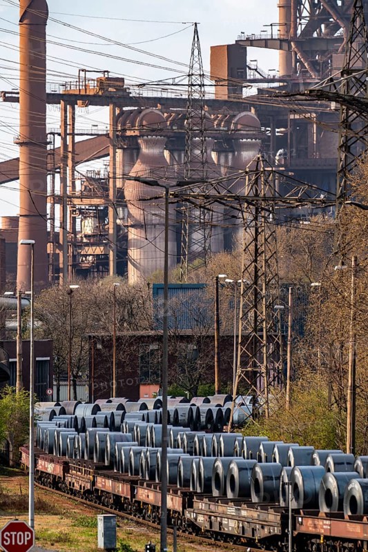Blast furnace Schwelgern 2, strip steel rolls, coils, on freight wagons, at the ThyssenKrupp Schwelgern plant in Duisburg-Marxloh, part of the Bruckhausen steelworks, North Rhine-Westphalia, Germany, Europe