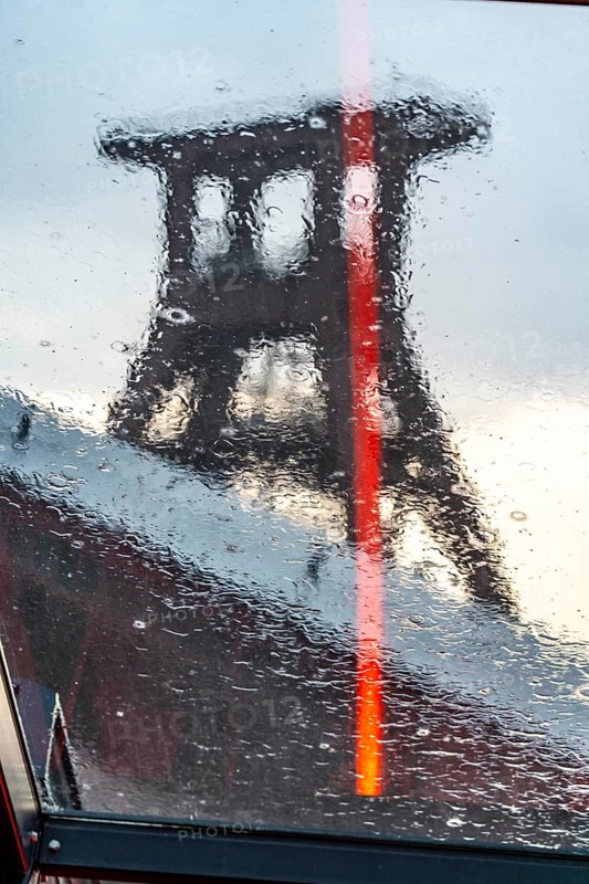 Zeche Zollverein, rainy day, ride on the escalator of the Ruhr Museum, in the coal washing plant, view of the double headframe of shaft XII, through rain-soaked windows, Essen, North Rhine-Westphalia, Germany, Europe