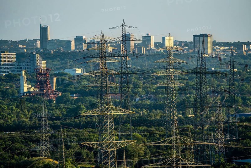 View over the central Ruhr area, from the north over Gelsenkirchen, with the former Consolidation mine on the skyscrapers of the city centre of Essen, energy supply, power lines, North Rhine-Westphalia, Germany, Europe