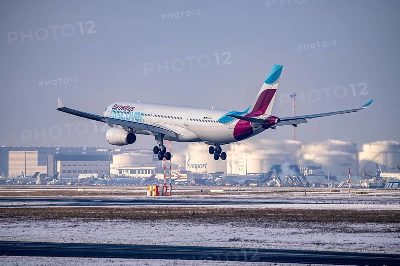 Discover Airbus A330-300 approaching Frankfurt FRA airport, fuelling depot, Fraport, in winter, Hesse, Germany, Europe
