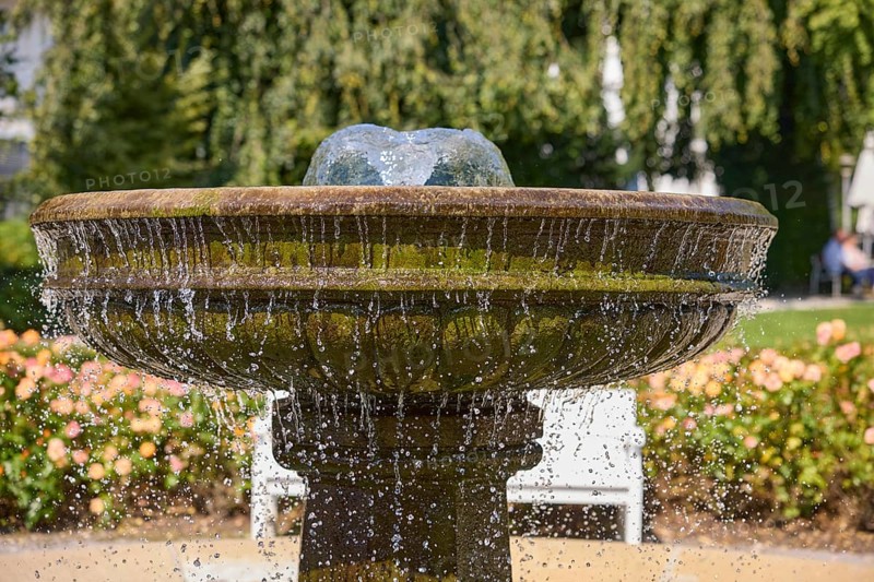 Fountain with falling drops of water in the rose garden park in Bad Salzuflen, Lippe district, North Rhine-Westphalia, Germany, Europe