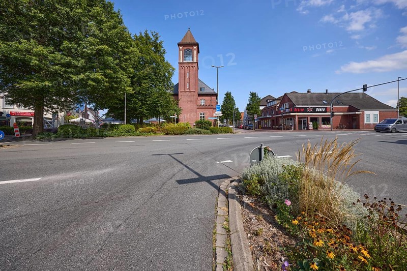 Old post office with brick tower at the intersection of Bürgermeister-Heidenreich-Straße and Neue Straße in Varel, district of Friesland, Lower Saxony, Germany, Europe