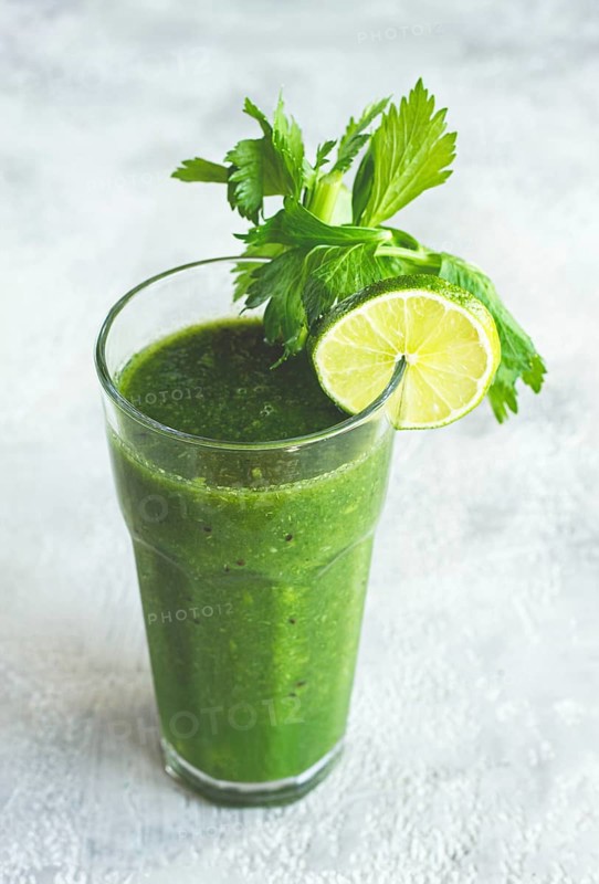 Glass with green smoothie, celery and spinach, apple and kiwi, cucumber, vegetable smoothie, breakfast, homemade, no people