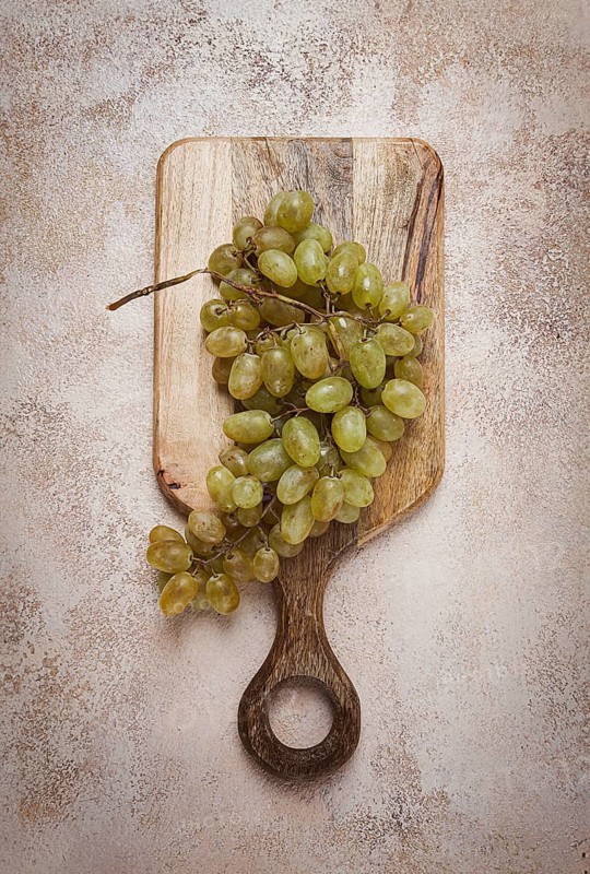 A branch of white grapes, wine grapes, Georgian grape variety Rkatsiteli, top view