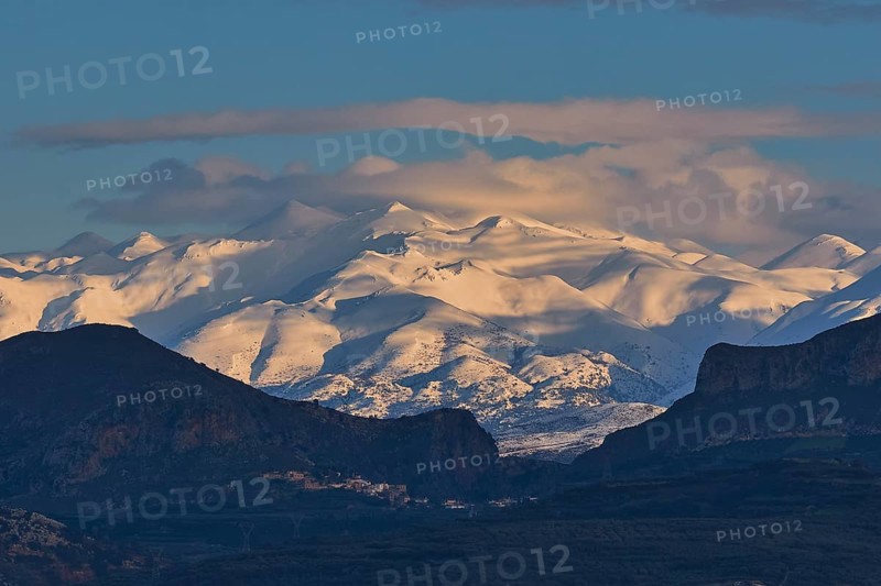 Snowy mountains under dark sky with clouds during twilight, Lefka Ori, White Mountains, mountain massif, west, Crete, Greece, Europe