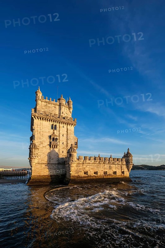 Belem Tower or Tower of St Vincent, famous tourist landmark of Lisboa and tourism attraction, on the bank of the Tagus River Tejo on sunset. Lisbon, Portugal, Europe