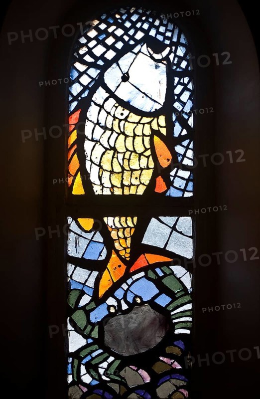 Contemporary stained glass at Notre Dame de la delivrance church, Popenguine, Senegal. Popenguine is a christian pilgrimage site since the apparition of the black madonna in 1986