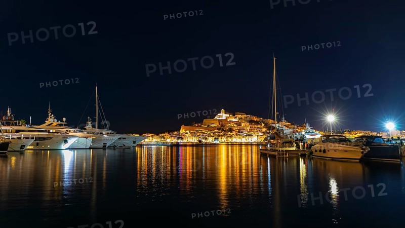 Luxury yachts anchoring in the harbour, behind the illuminated fortress and the old town, night shot, Eivissa, Ibiza Town, Ibiza, Balearic Islands, Mediterranean Sea, Spain, Europe