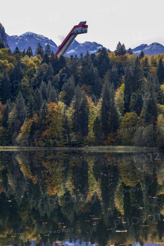 Freibergsee lake in autumn, behind it the Heni-Klopfer ski jump, Allgäu Alps, Allgäu, Bavaria, Germany, Europe