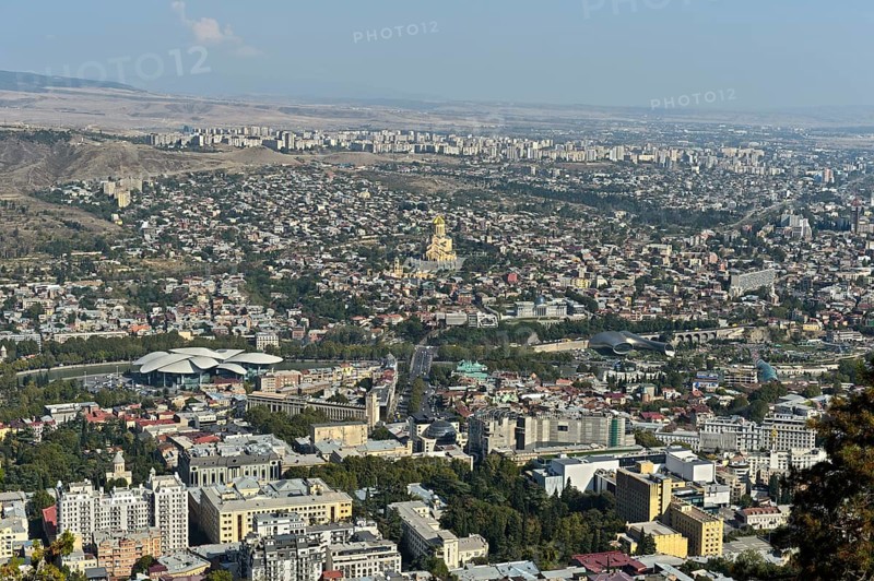 View of Tbilisi from Mount Mtazminda, important buildings from left to right: House of Administrative Services, Sameba Cathedral, former presidential palace, theatre and exhibition hall in Rike Park, Tbilisi, Georgia, Asia