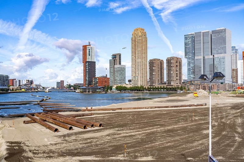 The Rijnhaven, a 28-hectare harbour basin, has now been filled in by almost a third to create space for up to 3, 000 flats, there will be an artificial beach, a floating park connected by jetties, restaurants and shops, cultural facilities, a major urban development project in the old harbour, the Rijnhaven borders on the popular Kop van Zuid and Katendrecht districts, Rotterdam, Netherlands