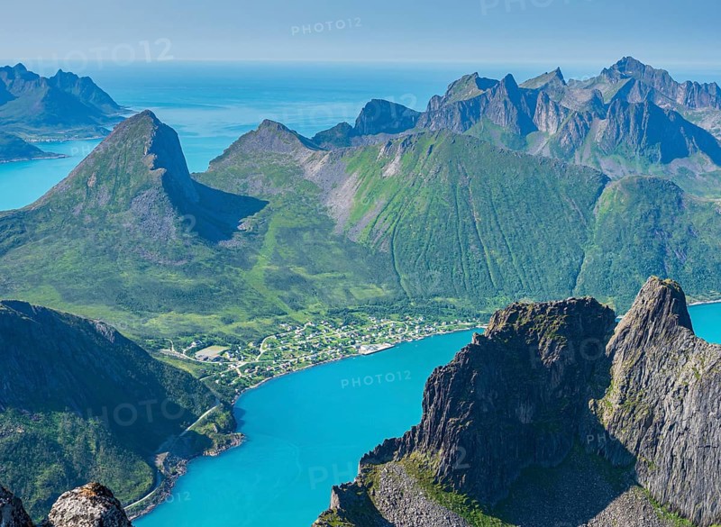 View over fjord Örnfjord, village Fjordgard, peak of Segla (left) and Hesten, seen from mountain Grytetippen, island Senja, Troms, Norway, Europe