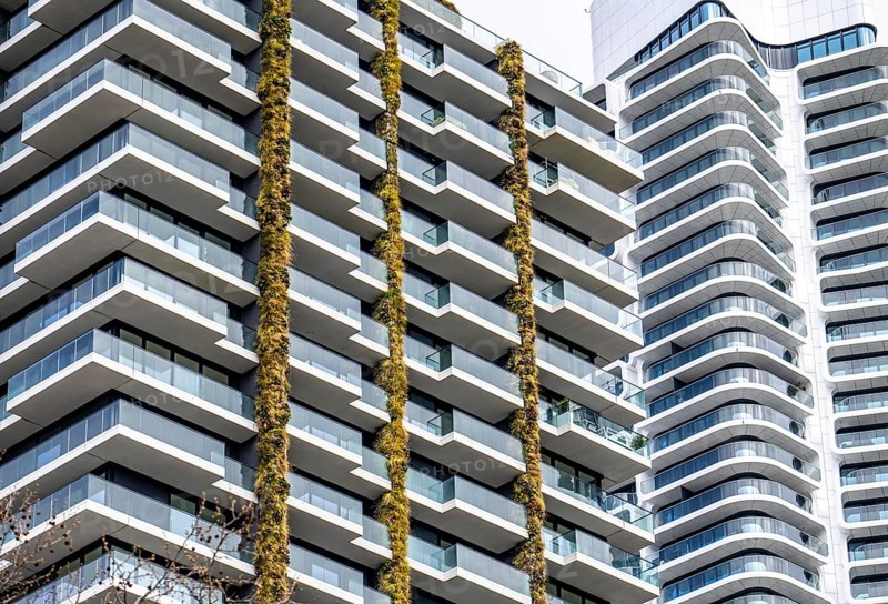 Facade of the Eden Tower on Europa-Allee in Frankfurt am Main, green facade, residential building, apartment building, on the right the Grand Tower building, flats, Hesse, Germany, Europe