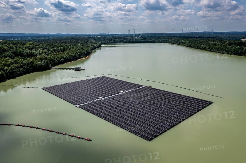 Germany's largest floating solar power plant on the Silbersee III, a quarry pond no longer used for sand mining, near Haltern am See, operated by Quarzwerke GmbH, around 5800 solar modules, on an area of a good 2 football pitches, generate 3.1 megawatts of power, the company uses the electricity itself on weekdays, at weekends it flows into the public grid, North Rhine-Westphalia, Germany, Europe
