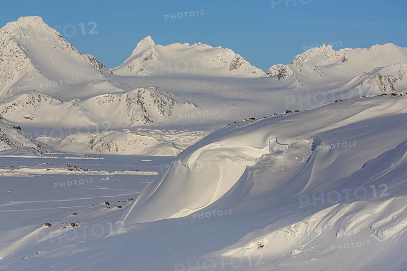 Mountainous winter landscape in the Arctic, sunny, Kulusuk, East Greenland, Greenland, North America