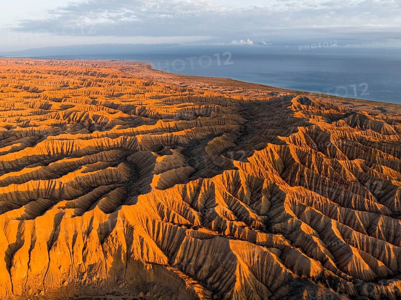 Landscape of eroded hills at Lake Issyk Kul, Badlands at sunrise, aerial view, Canyon of the Forgotten Rivers, Issyk Kul, Kyrgyzstan, Asia