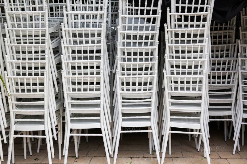 Close-up of stackeed white plastic armchairs in outdoor storage area, Kotor, Montenegro, Europe