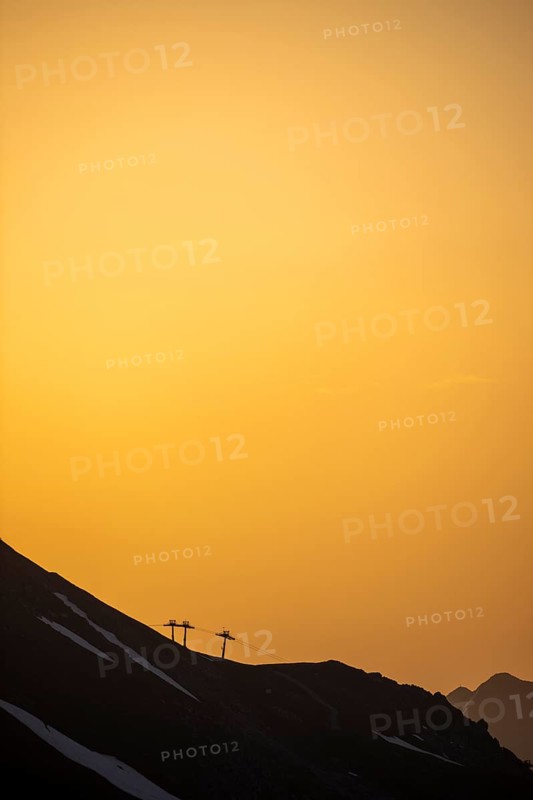 Summit with ski lift masts in the morning light, Lech, Lechquellengebirge, Vorarlberg, Austria, Europe
