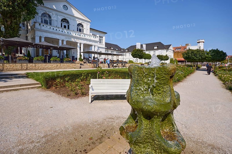 Park, rose garden with fountain, bench and Leopold Bad restaurant in Bad Salzuflen, Lippe district, North Rhine-Westphalia, Germany, Europe