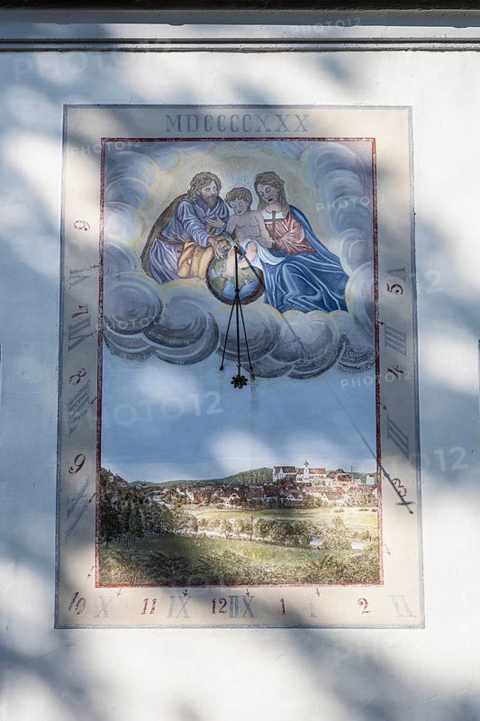A sundial on the parish church of St. Nicholas in the centre of Scheer, Danube Valley, Sigmaringen district, Baden-Württemberg, Germany, Europe