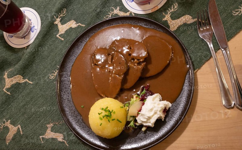 Roast beef with gingerbread sauce and dumplings, served in a Franconian inn, Bavaria, Germany, Europe