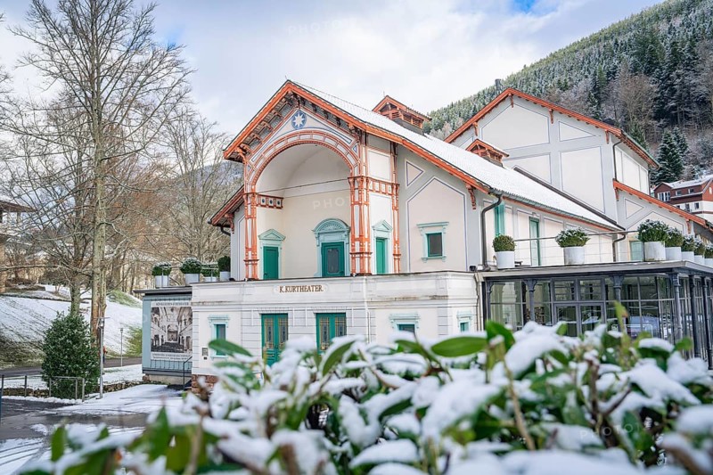 Historic theatre in a snow-covered winter landscape with wooded mountains in the background, Royal Spa Theatre, Bad Wildbad, Black Forest, Germany, Europe