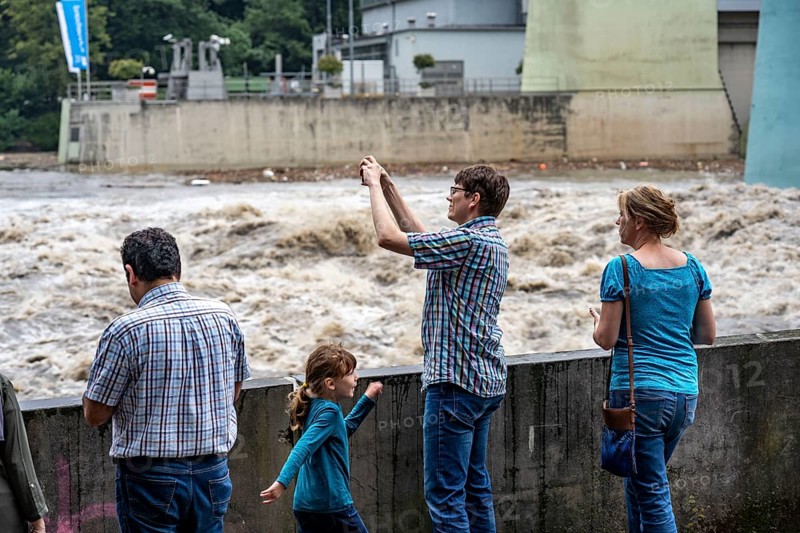 Weir of the Lake Baldeney in Essen, the masses of water roar through the open weirs, spectators, onlookers, high water on the Ruhr, after long heavy rains the river came out of its bed and flooded the landscape and villages, the highest water level ever measured, North Rhine-Westphalia, Germany, Europe