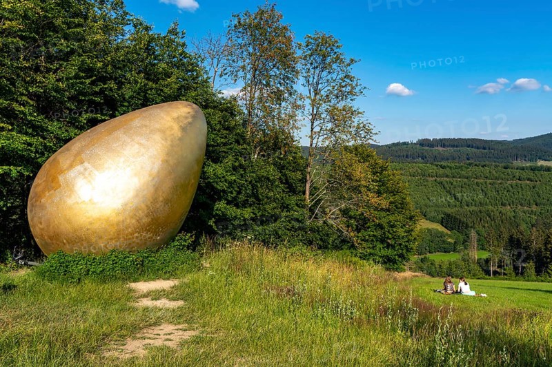Forest Sculpture Trail Wittgensteiner Sauerland, 23 kilometre long trail, part of the Rothaarsteig, sculpture Was Was Zürst?, large golden egg, landscape in the Sauerland, Rothaargebirge, north-west, above the town of Bad Berleburg, North Rhine-Westphalia, Germany, Europe