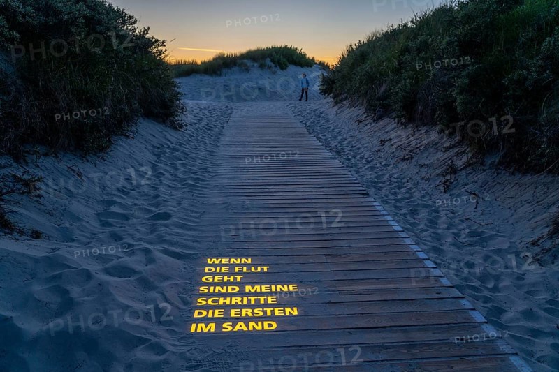 North Sea island Langeoog, beach access with luminous poem, light installation, When the tide goes out my steps are the first in the sand, Lower Saxony, Germany, Europe