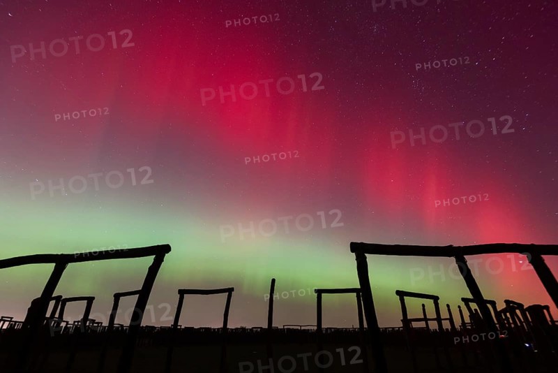 Northern lights (aurora borealis) over the ring sanctuary of Pömmelte, prehistoric circular ditch complex, also known by archaeologists as the German Stonehenge, Pömmelte, Saxony-Anhalt, Germany, Europe