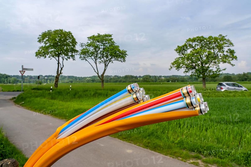 Fibre optic cable, freshly laid along a dirt track, at a paddock, awaiting further expansion, extension, provision of high-speed Internet in rural areas, Mülheim an der Ruhr, North Rhine-Westphalia, Germany, Europe